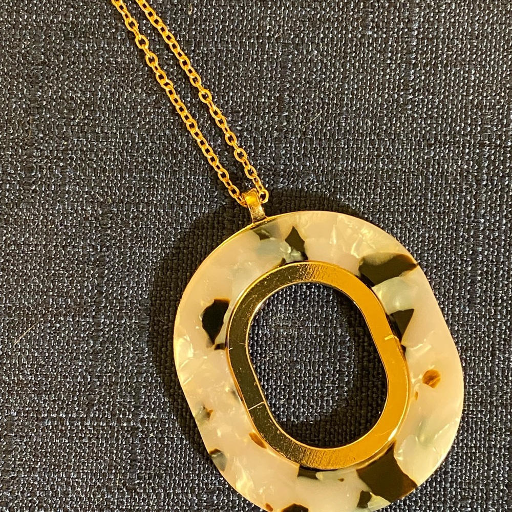 18 inch long adjustable necklace with tortoise shell look gold on back